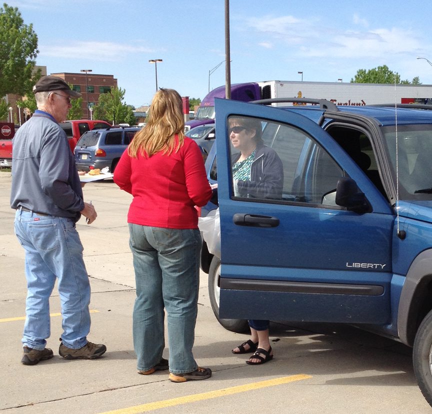 Volunteers Doug Lund an Nikki Bohl collect prescription medications from community members in the parking lot North of Good Samaritan Hospital on Saturday, April 28th.