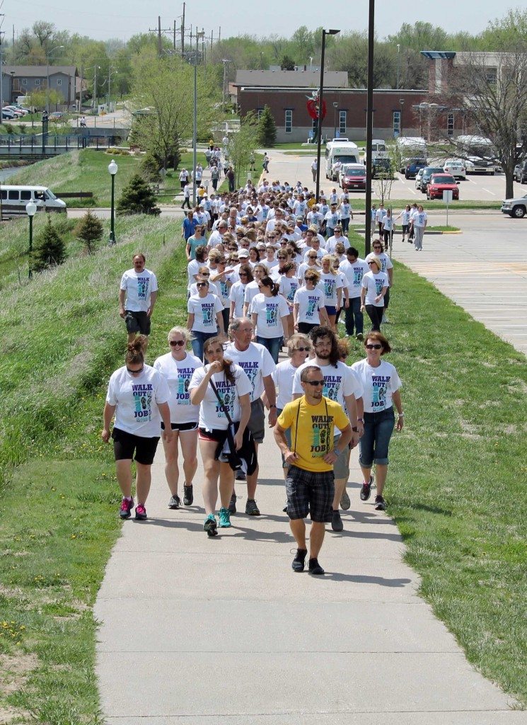 Activate Buffalo County coalition member Bryce Abbey leads the way as Buffalo County workers “walk out on their jobs”.